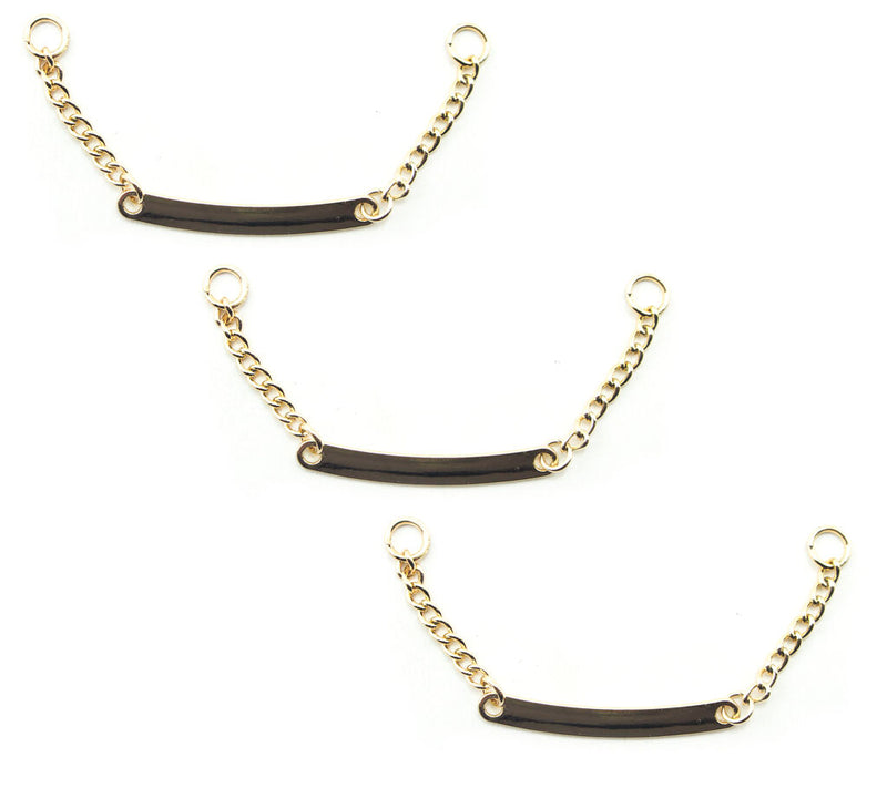Set of 3 gold tone metal sew on coat hangers displayed.