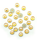 Pack of 25 gold tone circular embellishments with amber-rose crystals.