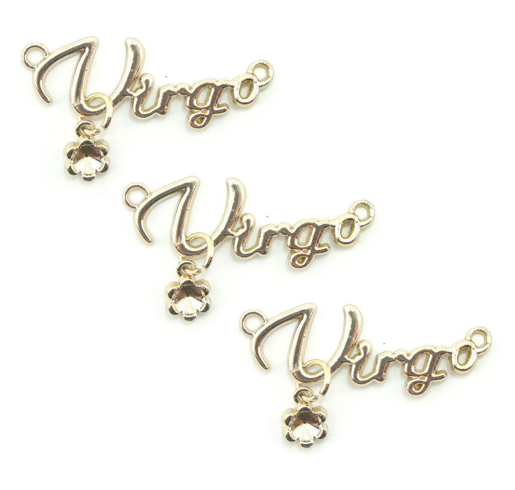 Set of three gold tone metal Virgo pendants displayed together.
