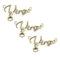 Set of three gold tone metal Virgo pendants displayed together.