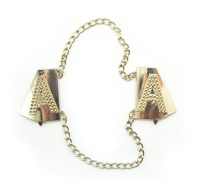 Gold tone metal Letter 'A' embellishment on fabric