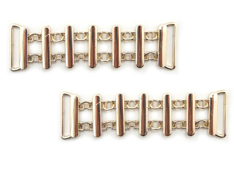 Gold tone metal 'Fence' design embellishment for jewellery.