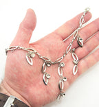 Close-up of the elegant leaf and star motifs on the chain.