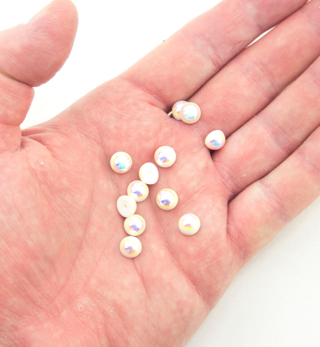 Close-up of an 8 mm pearlescent round trim with a metal pin backing.