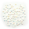 Pack of 100 pearlescent round trims in various colours.