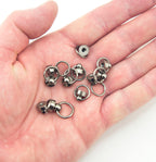 Close-up of binding screws showing size and decorative ring.
