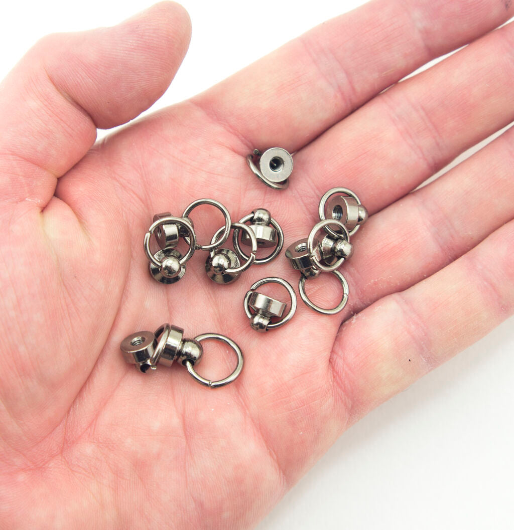Close-up of binding screws showing size and decorative ring.