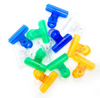 Pack of 12 colourful plastic bulldog paper clips on a white background.