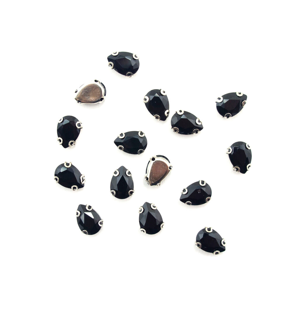 Set of 15 black teardrop glass crystal sew in trims on display.