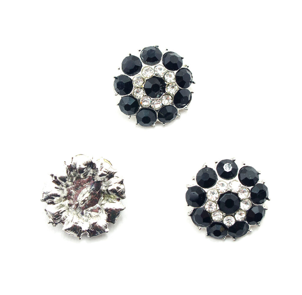 Set of 3 black and clear glass crystal buttons in metal mounts.