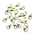 Pack of 20 gold-tone lobster claw clasps displayed in a row