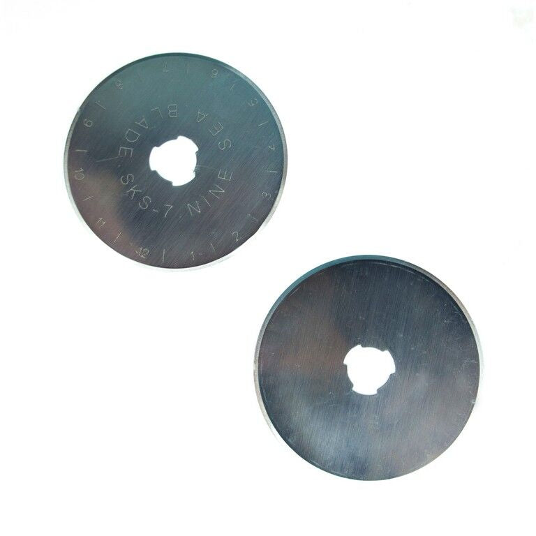 Two 45 mm rotary blades for straight cutting, packaged for easy storage.
