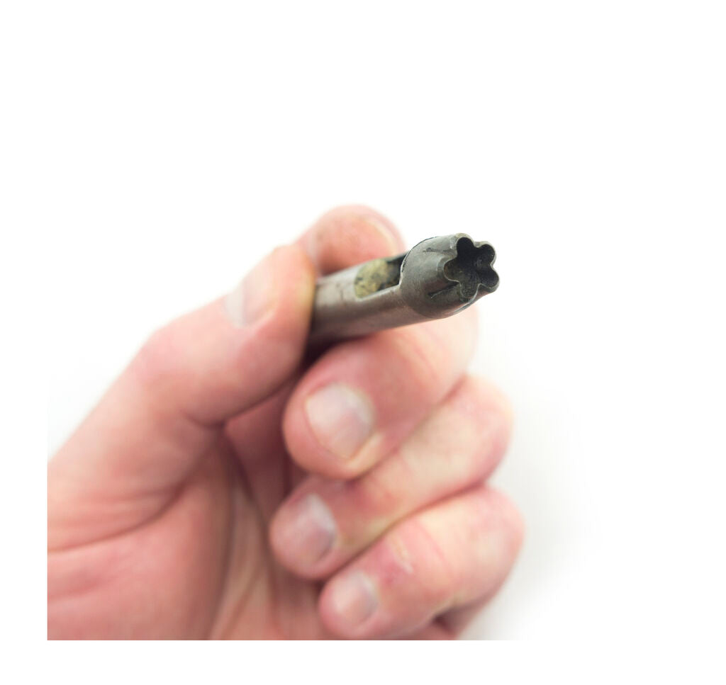Steel leather punch tool with a 5 point rounded star design.