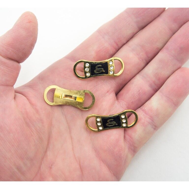 Close-up of the gold-tone embellishments with clear crystals.