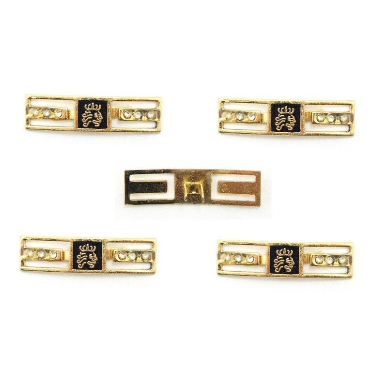 Gold-tone crown embellishment with crystals on a white background.