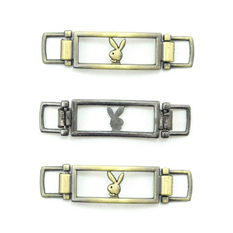 Set of 3 gold-gunmetal-tone bunny embellishments for leather goods.