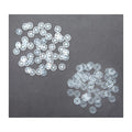 Clear plastic press stud buttons displayed on a white background.