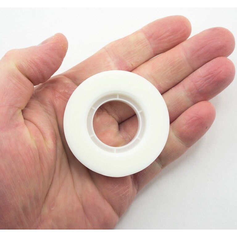 Invisible matt tape applied to paper, demonstrating its virtually invisible finish.