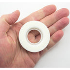 Invisible matt tape applied to paper, demonstrating its virtually invisible finish.