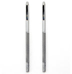 Two 1.5 mm round steel leather punches on a wooden surface.