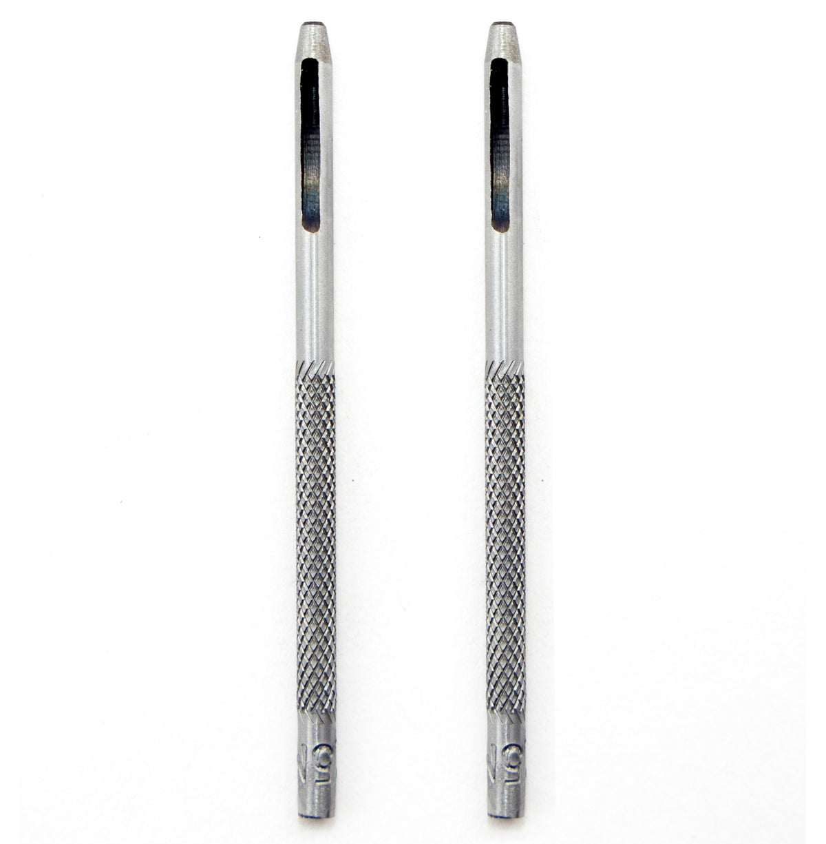 Two 1.5 mm round steel leather punches on a wooden surface.