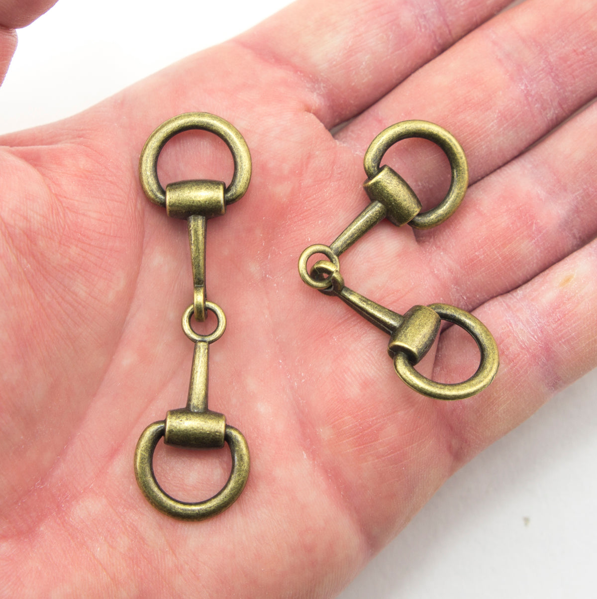 Set of two antique gold buckles suitable for various accessories.