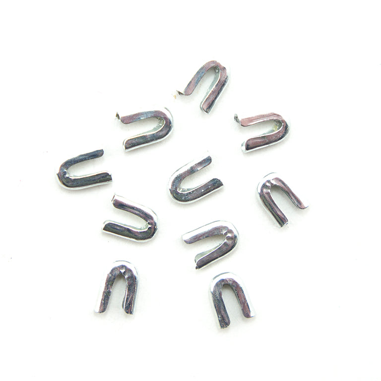 Set of 10 metal ends for 5 mm spiral boning in silver tone.