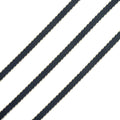 Black and gold ribbon trim displayed on a white background.