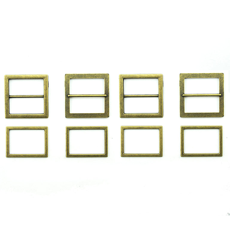 Antique gold tone metal buckles for shoes and bags on display.