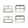Four silver tone metal buckles displayed on a white background.