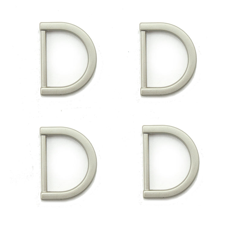 Set of 4 silver tone metal D rings for crafting projects.