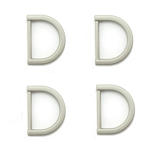 Set of 4 silver tone metal D rings for crafting projects.