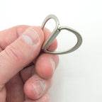 D rings displayed with a measuring tape for size reference.