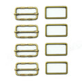 Four antique gold tone metal buckles displayed together.