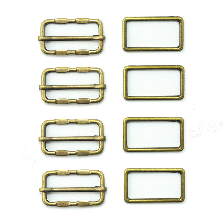 Four antique gold tone metal buckles displayed together.