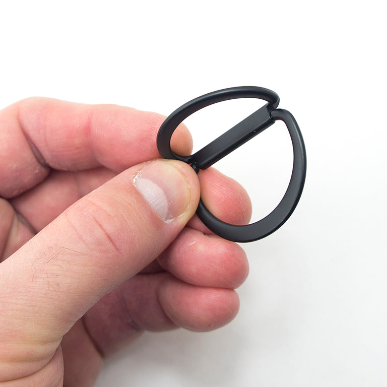 D rings in use on a stylish belt and bag setup.