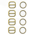 Four antique gold tone two-part metal buckles on display.