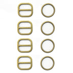 Four antique gold tone two-part metal buckles on display.