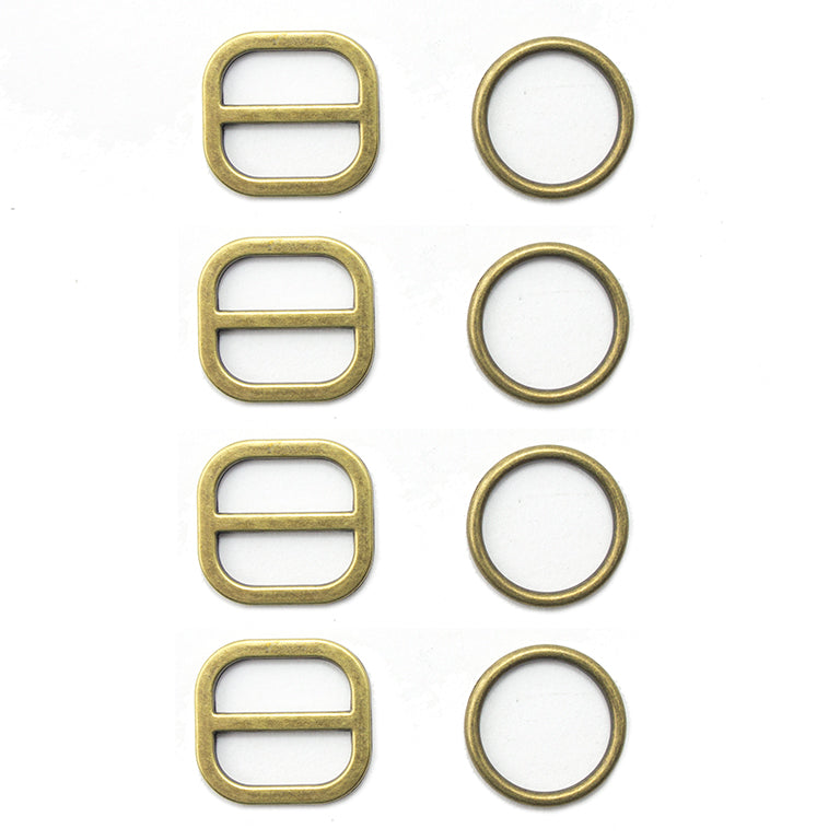 Four antique gold tone two-part metal buckles on display.