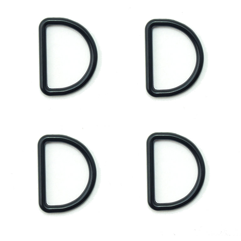 Four black metal D rings for crafting and accessories.