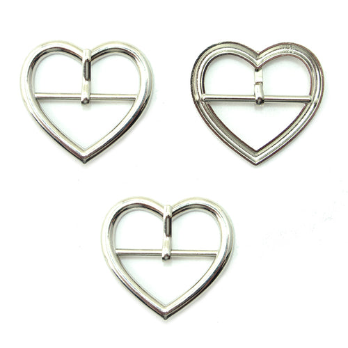 Three silver tone metal heart shaped buckles for accessories.