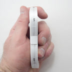 A roll of 500 white silk size tabs labelled SMALL (S)