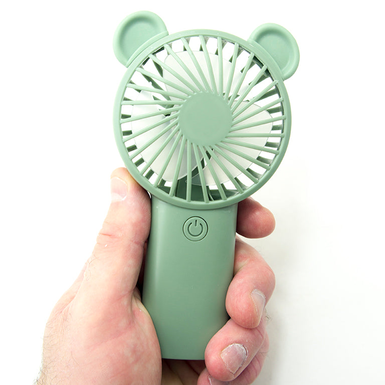 Compact fan in a travel-friendly design, ideal for summer heat relief.