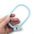 Close-up of the 11 x 7 cm plastic embroidery hoop showcasing its shape.