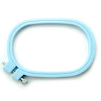 Small rounded rectangular plastic embroidery hoop on a white background.