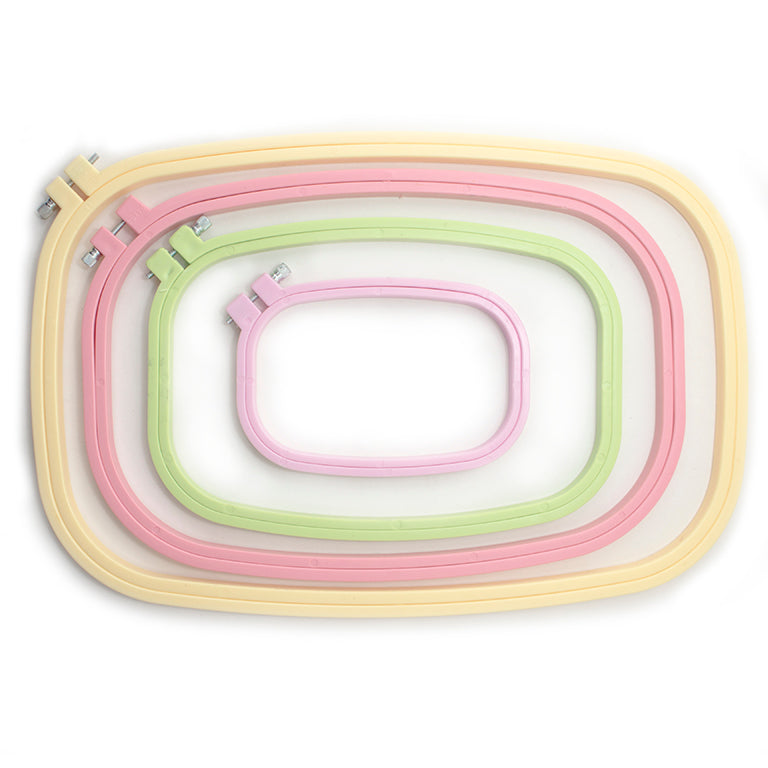 Four rounded rectangle plastic embroidery hoops in various sizes.
