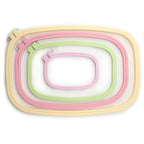 Four rounded rectangle plastic embroidery hoops in various sizes.