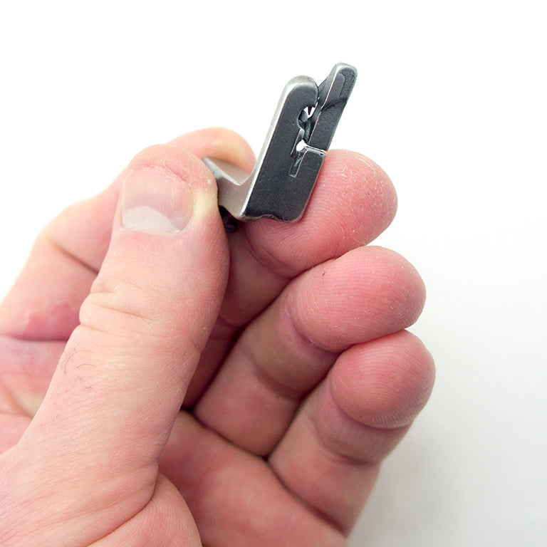 Hemming foot dimensions displayed on a measuring tape