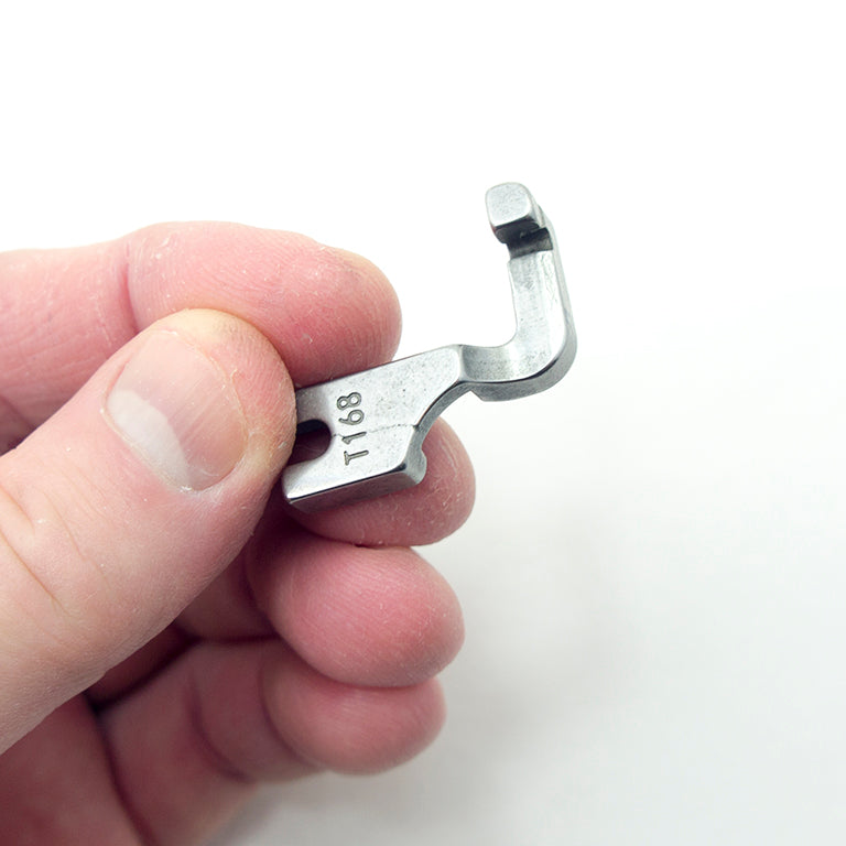 Close-up of the T168 presser foot showing its dimensions