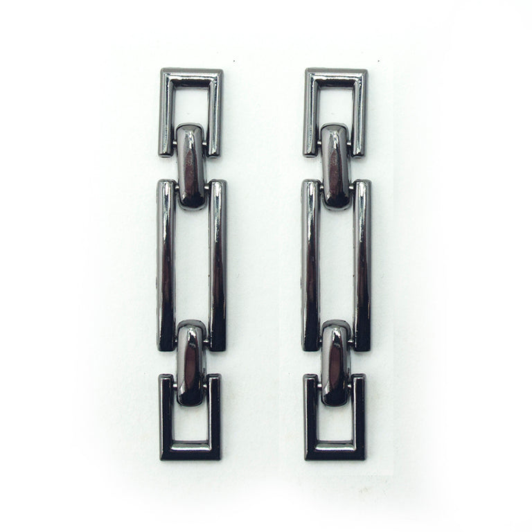 Dark gunmetal tone hinged metal equestrian buckle on a white background.